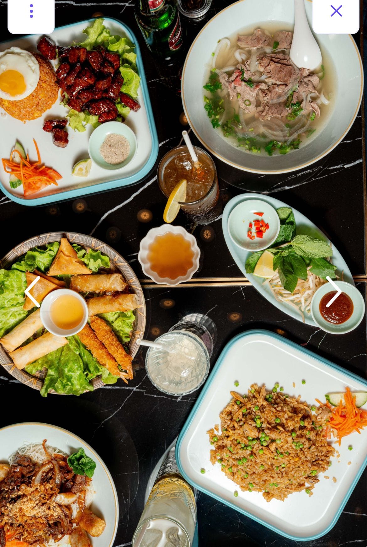 Table dressée avec nems, pho et accompagnements